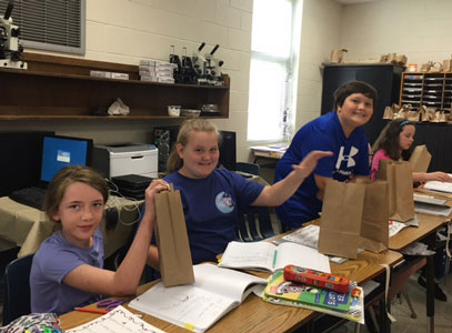 Zoe Miller, Kaitlin Jarrett, and Jamison Pressley creating their baskets.
