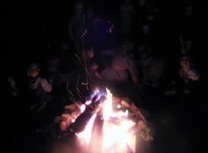 Listening to ghost tales the adults conjure up.