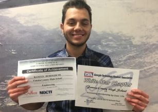 Ramtin Doroodchi holding his NOCTI Engineering Certificate and the TSA White Star Chapter Award